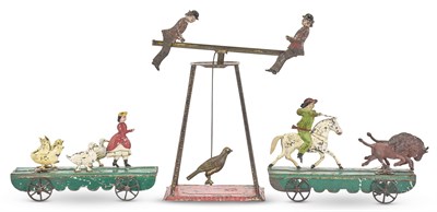 Lot 1343 - Two Painted Tin Platform Toys Comprising one...