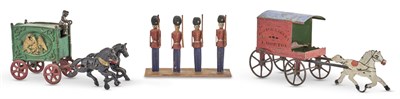 Lot 1348 - Painted Cast Iron Circus Wagon With a rider,...