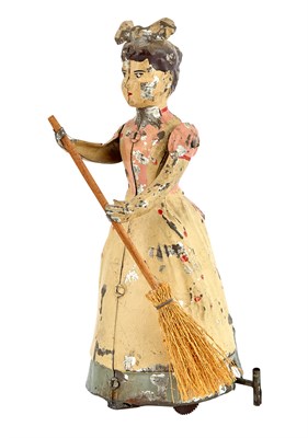 Lot 142 - Female with Broom Mechanical Tin Toy Charming...