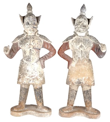 Lot 24 - Two Similar Chinese Painted Pottery Guardian...