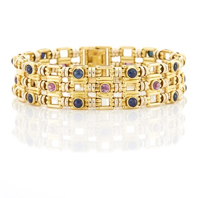 Lot 1149 - Gold, Cabochon Sapphire and Ruby Bracelet