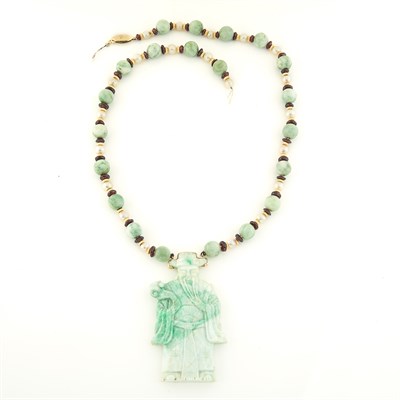 Lot 1712 - Carved Nephrite, Cultured Pearl and Gold Pendant-Necklace