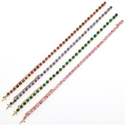 Lot 1603 - Four Gold and Simulated Stone Bracelets
