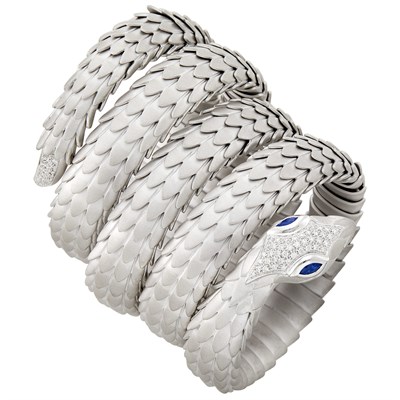 Lot 396 - Coiled Sterling Silver, White Gold, Diamond and Sapphire Snake Bracelet