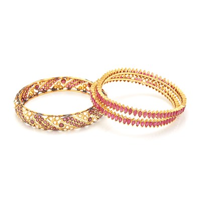 Lot 1667 - Three Gold and Gem-Set Bangle Bracelets