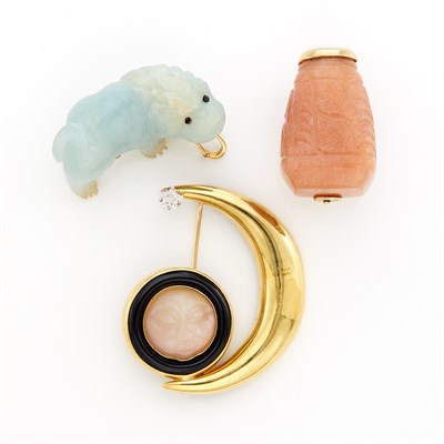 Lot 1217 - Gold, Carved Moonstone, Enamel and Diamond Moon Brooch and Two Carved Hardstone Brooches