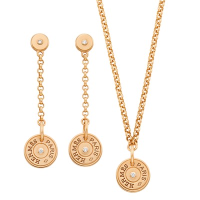 Lot 655 - Rose Gold and Diamond 'Clou de Selle' Pendant-Necklace and Pair of Pendant-Earrings, Hermès, France