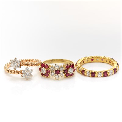 Lot 1433 - Gold, Ruby and Diamond Band Ring and Two Gold and Ruby Floret Rings