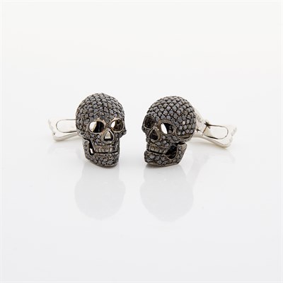 Lot 1173 - Pair of White Gold and Black Diamond Skull Cufflinks, Deakin & Francis