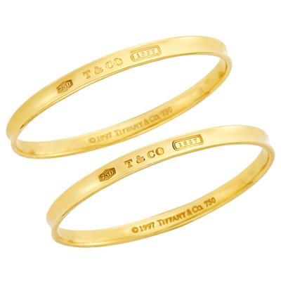 Lot 367 - Pair of Gold '1837 Collection' Bangle Bracelets, Tiffany & Co.