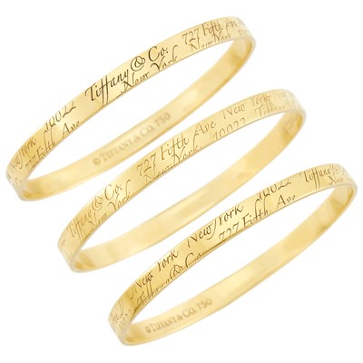 Lot 1 - Tiffany & Co. Three Gold 'Notes' Bangle Bracelets