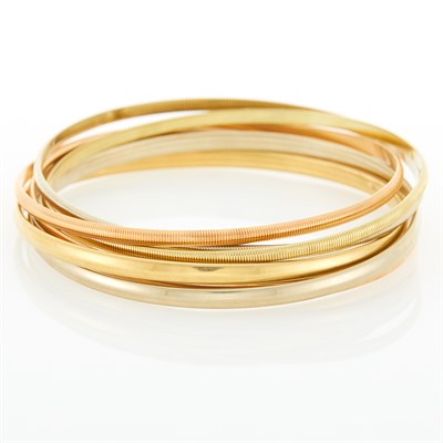 Lot 28 - Two Tricolor Gold Interlocking Bangle Bracelets