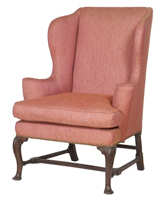 Lot 313 - George II Walnut Wing Armchair The padded back,...