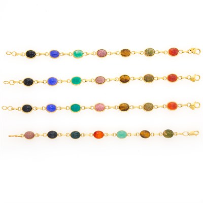 Lot 1124 - Four Gold and Hardstone Scarab Bracelets