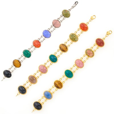 Lot 104 - Three Gold, Sterling Silver and Hardstone Scarab Bracelets