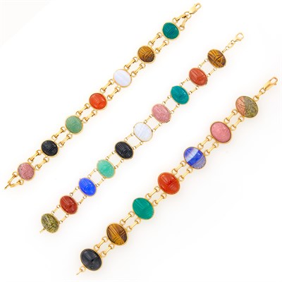 Lot 1204 - Three Double Strand Gold and Hardstone Scarab Bracelets