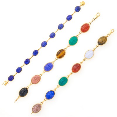 Lot 1114 - Three Gold, Lapis and Hardstone Scarab Bracelets