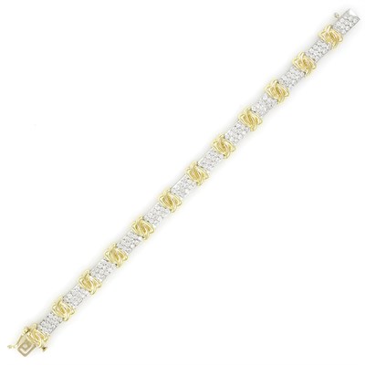 Lot 55 - Two-Color Gold and Diamond Bracelet