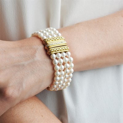 Lot 251 - Four Strand Cultured Pearl, Gold and Diamond Bracelet