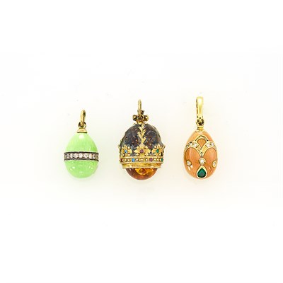 Lot 103 - Gold, Peach Enamel, Diamond and Emerald Egg Pendant and Two Gold, Silver-Gilt and Enamel Egg Pendants