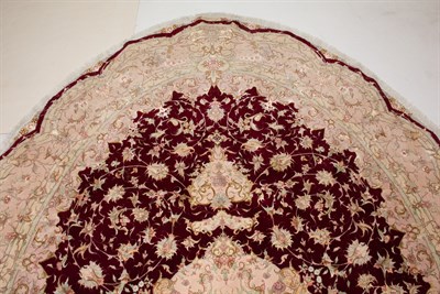Lot 384 - Oval Kurkwool and Silk Tabriz Carpet Northwest...