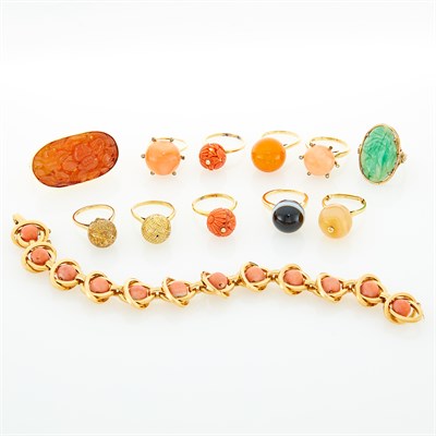 Lot 95 - Eleven Carved Coral and Jade, Amber, Agate, Gold and Gold-Plated Ball Rings and Coral Bead Bracelet
