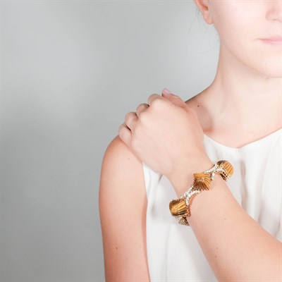Lot 21 - Gold, Carved Tiger's Eye and Diamond Bracelet