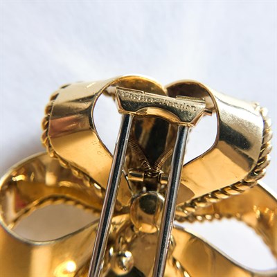 Lot 22 - Cartier London Gold and Diamond Bow Clip-Brooch