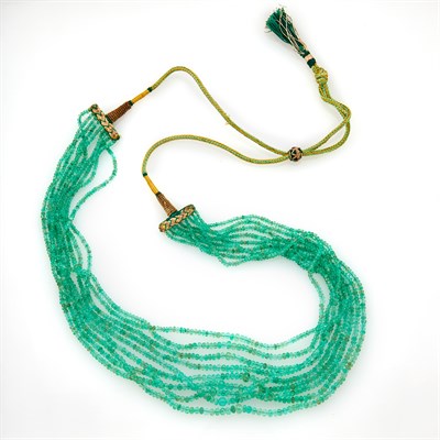 Lot 1206 - Nine Strand Emerald Bead and Cord Necklace