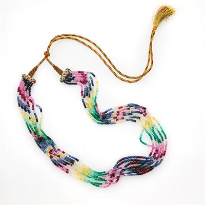 Lot 1193 - Seven Strand Multicolored Sapphire, Ruby and Emerald Bead and Cord Necklace