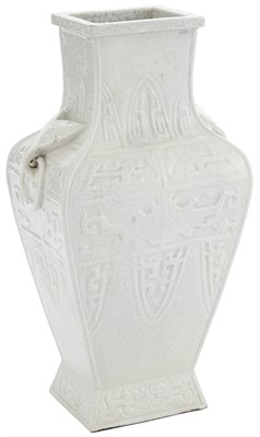 Lot 497 - A Chinese Carved and White Glazed Paste...
