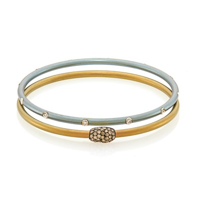 Lot 1268 - Pair of Two-Color Bronze and Silver Titanium, Gold and Diamond Bangle Bracelets