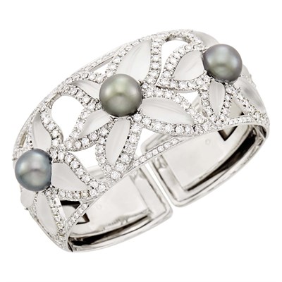 Lot 33 - White Gold, Carved Frosted Rock Crystal, Black Cultured Pearl and Diamond Flower Cuff Bangle Bracelet