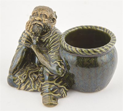 Lot 113 - A Japanese Green Glazed Earthenware Figural...