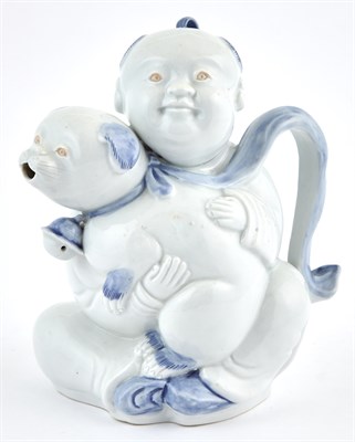 Lot 139 - A Japanese Hirado Porcelain Boy and Pup-Form...