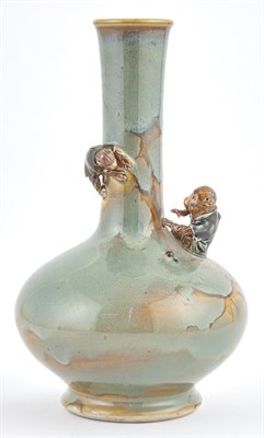 Lot 120 - A Japanese Glazed and Molded Ceramic Bottle...