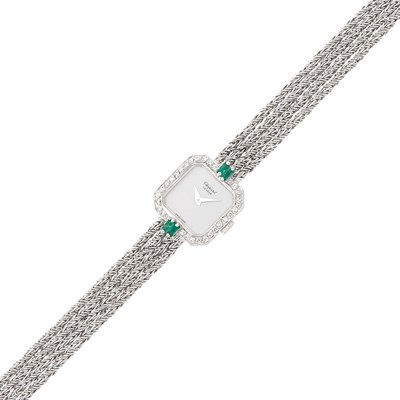 Lot 108 - Chopard Four Strand White Gold, Emerald and Diamond Wristwatch