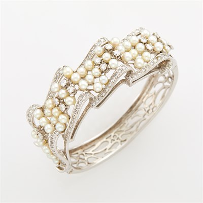 Lot 104 - White Gold, Cultured Pearl and Diamond Bangle Bracelet