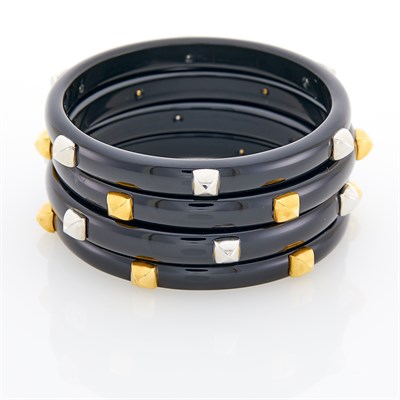 Lot 5 - Four Black Onyx and Two-Color Gold Bangle Bracelets