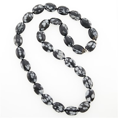 Lot 96 - Long Snowflake Obsidian Bead, White Gold and Diamond Necklace
