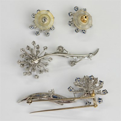 Lot 38 - Oscar Heyman Brothers Pair of Platinum, Sapphire and Diamond Flower Brooches and Pair of Earrings