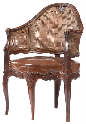 Lot 503 - Early Louis XV Walnut and Caned Fauteuil de...