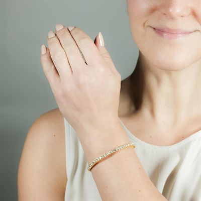 Lot 1077 - Gold and Diamond Bangle Bracelet