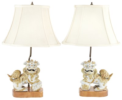 Lot 14 - Pair of Ochre Decorated White Ceramic Fu Dogs...