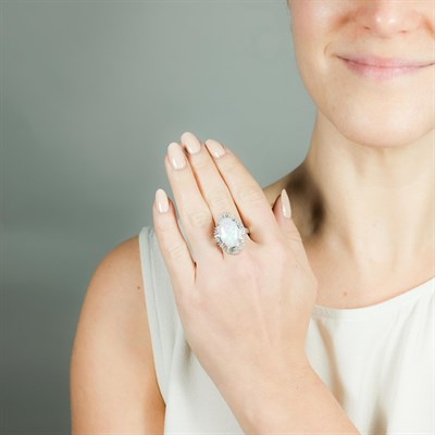 Lot 1057 - Platinum, Opal and Diamond Ring