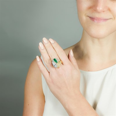 Lot 1064 - Two-Color Gold, Diamond and Emerald Crossover Ring