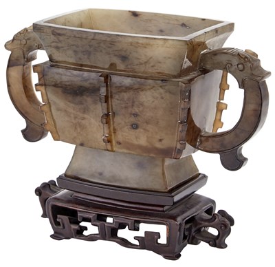 Lot 76 - A Chinese Archaistic Carved Agate Vessel Qing...