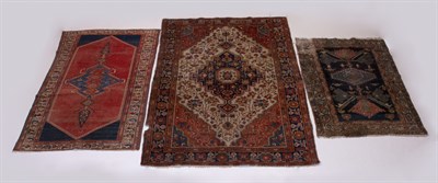 Lot 383 - Three Persian Rugs A Sarouk rug together with...