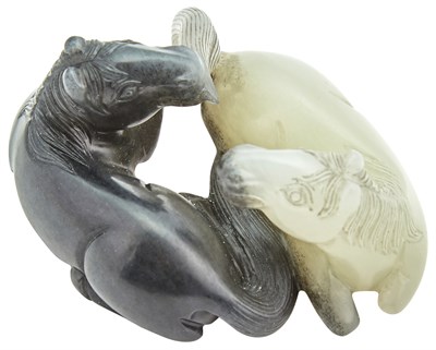 Lot 57 - A Chinese Black and White Jade Horse Grouping...