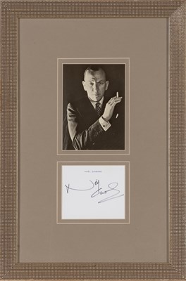 Lot 128 - COWARD NOEL Signed card in framed display. A 3...